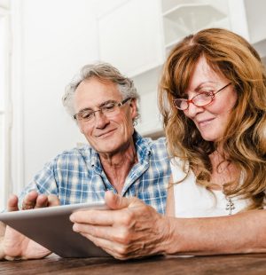 Older couple using tablet computer